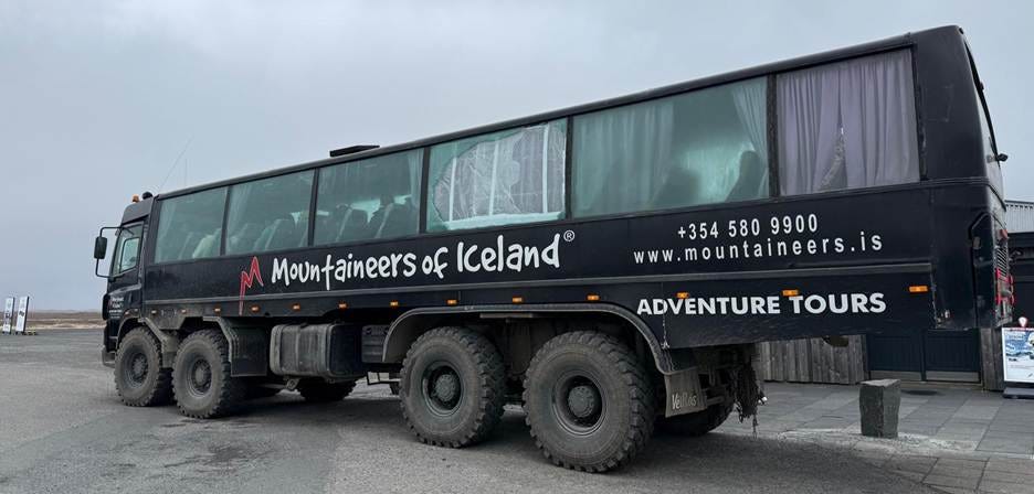 A large black truck with large windows

AI-generated content may be incorrect.