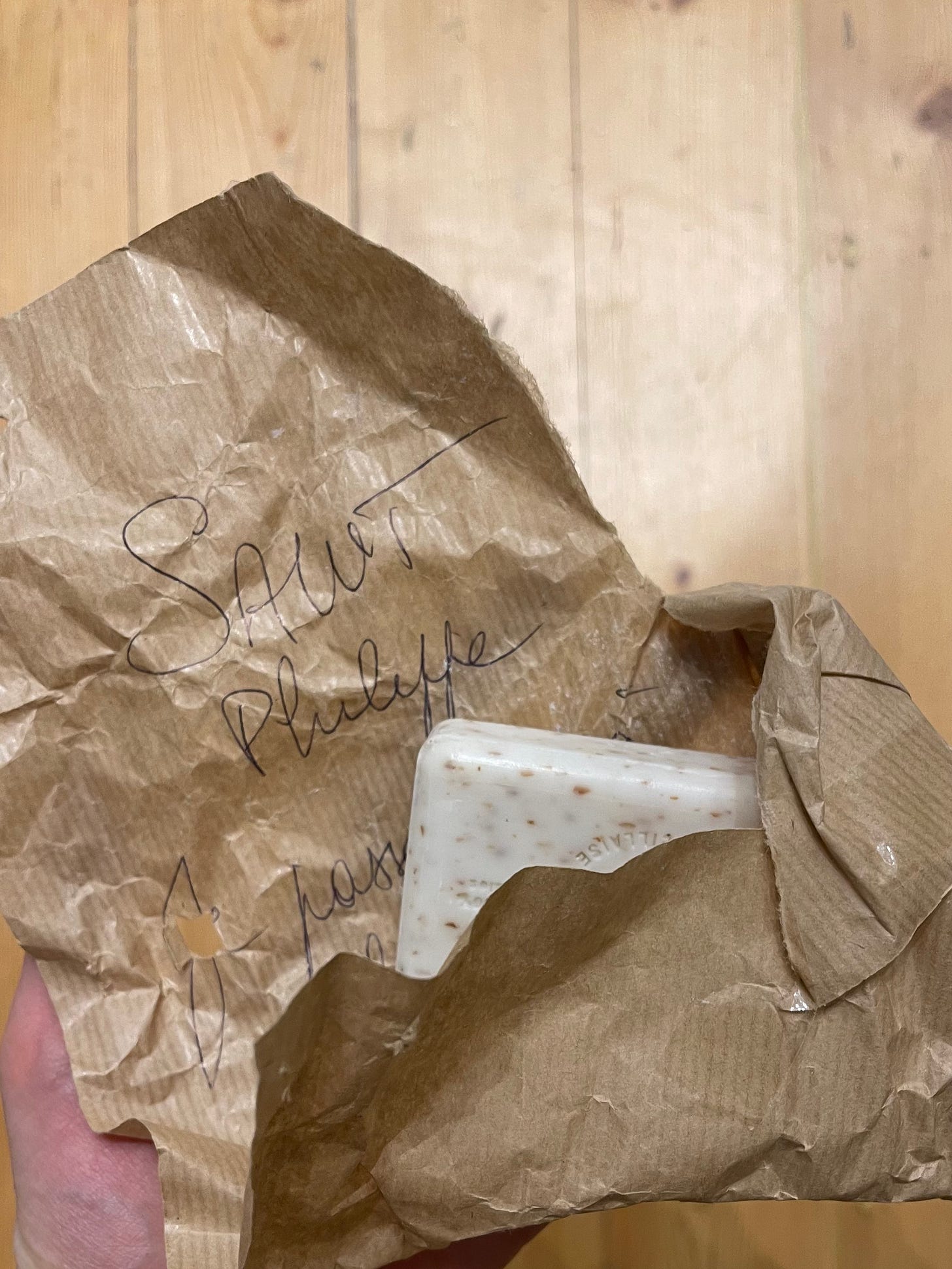 Piece of wax parchment with script writing in French