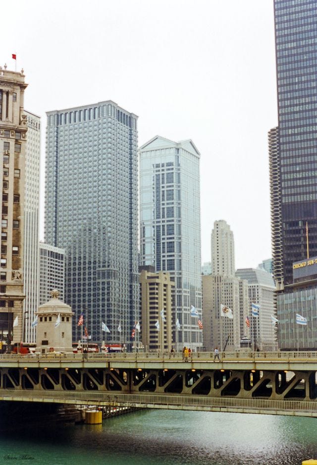 The Chicago River flowing under the historic Michigan Avenue Bridge, February 1996. The Chicago River flowing under the historic Michigan Avenue Bridge, February 1996.