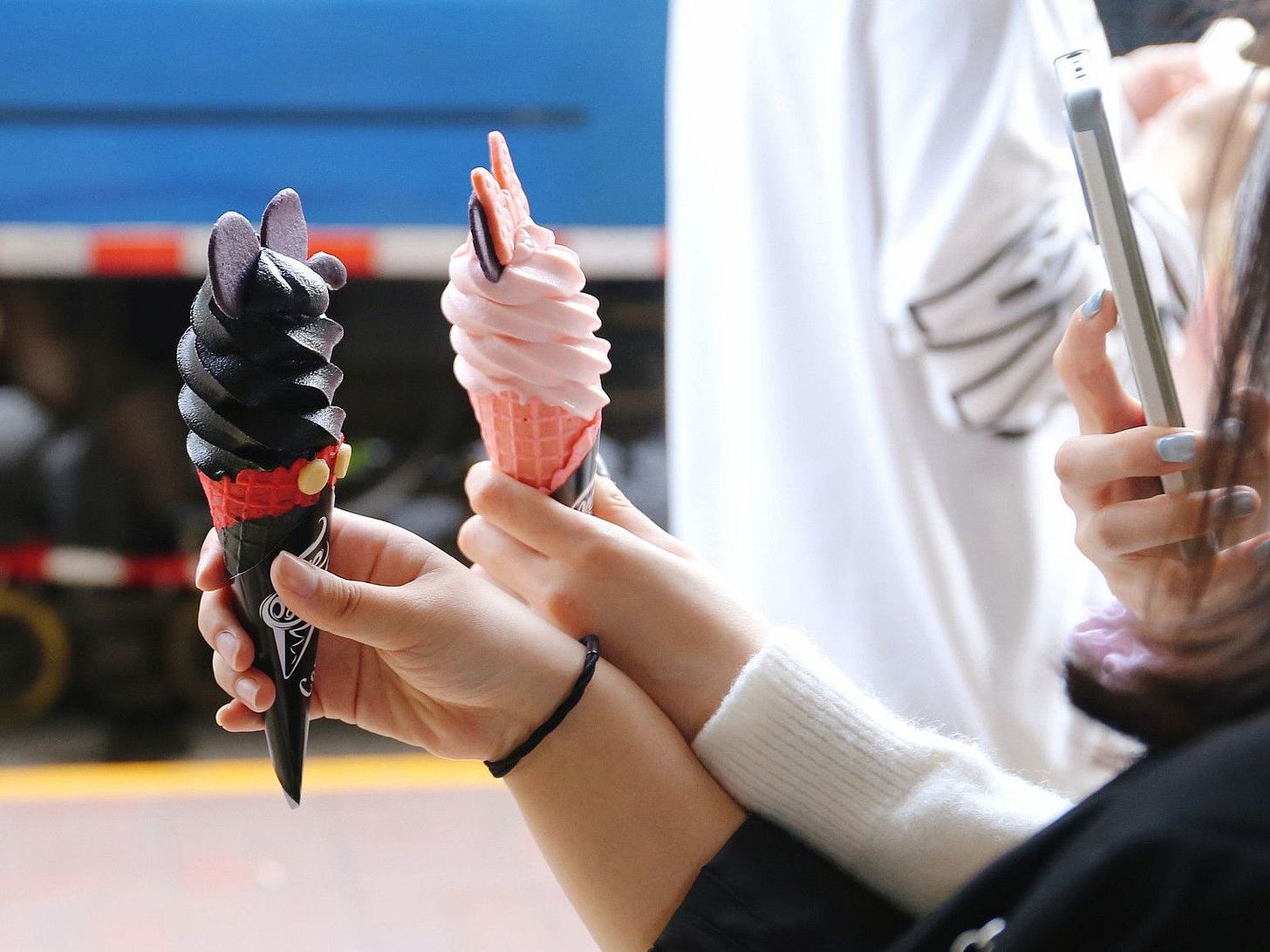 Young Chinese taking photos gelato Young Chinese taking photos gelato