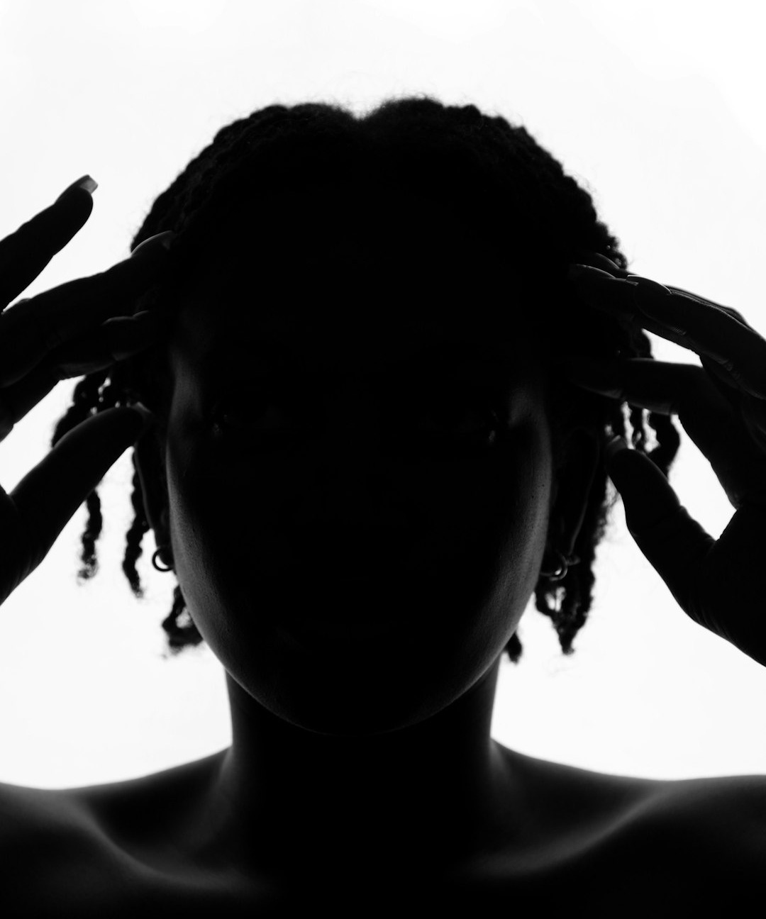 a black and white photo of a person with dreadlocks a black and white photo of a person with dreadlocks
