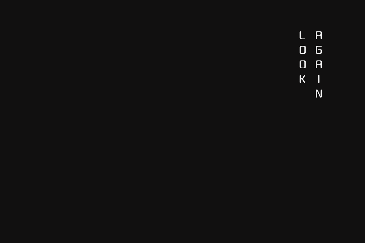 Graphic featuring the words "Look Again" in a vertical, two-column typographic layout on the right. The text is set against a solid black background, with the left two-thirds of the image remaining as open negative space.
