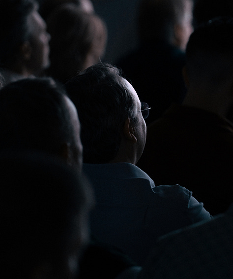 A gallery of 6 images showing close ups of the audience and zoomed out photographs of the Sana AI Summit stage.