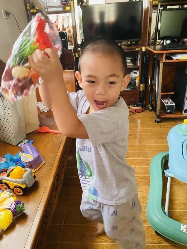 A little boy happy to receive gifts for Christmas