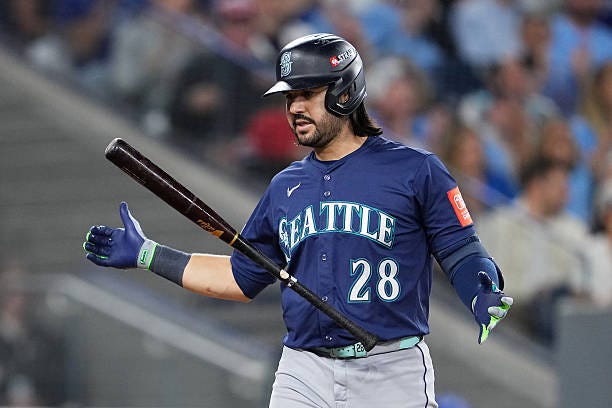Eugenio Suarez of the Seattle Mariners reacts after striking out during the fourth inning against the Toronto Blue Jays in game seven of the American...