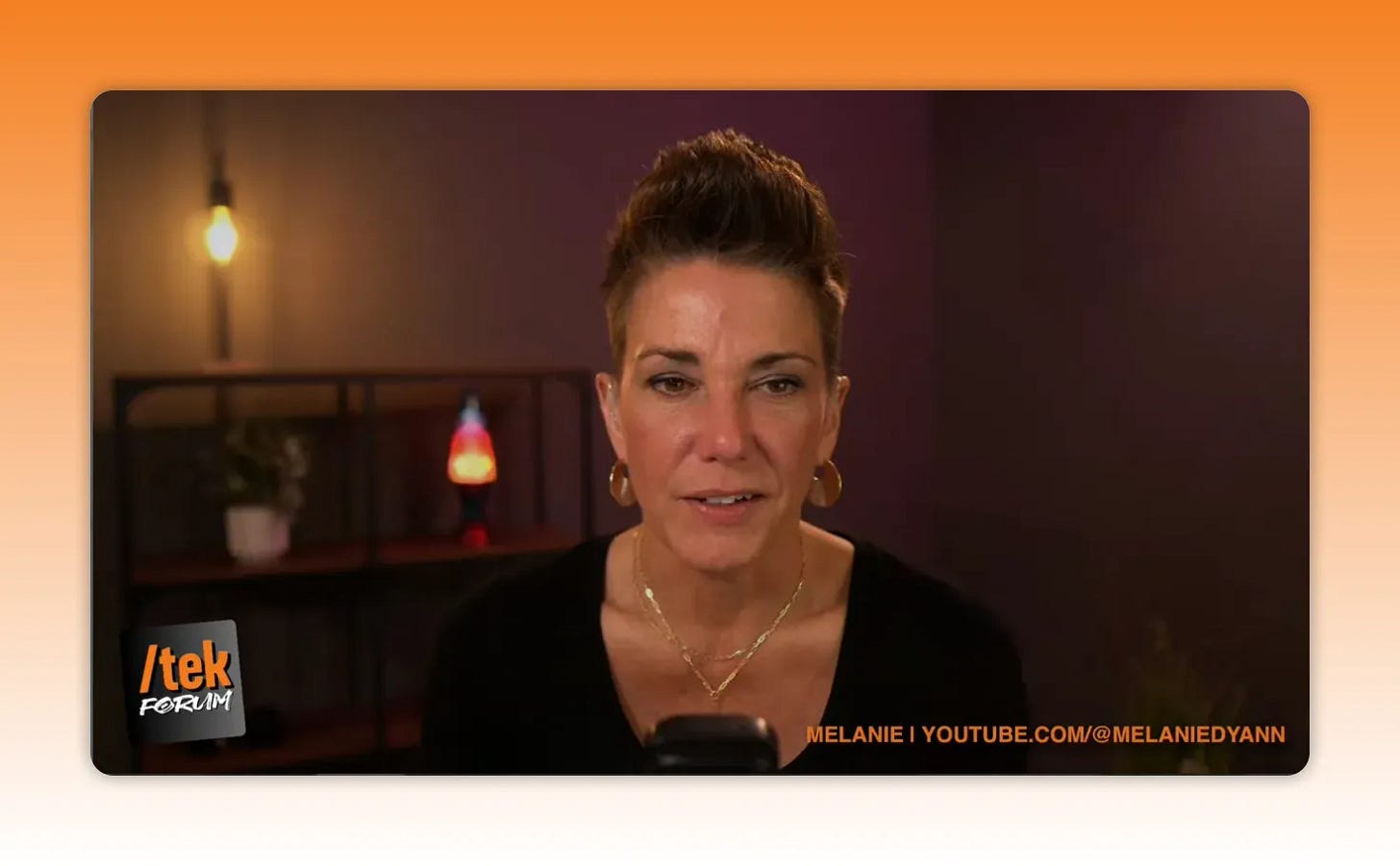 well-lit head-and-shoulders shot on home studio set with warm practical lights