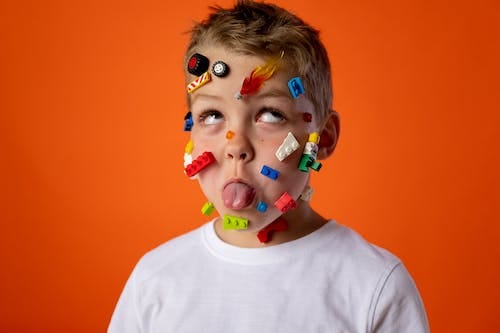 Free Boy in White Crew Neck Shirt With Face Paint Stock Photo
