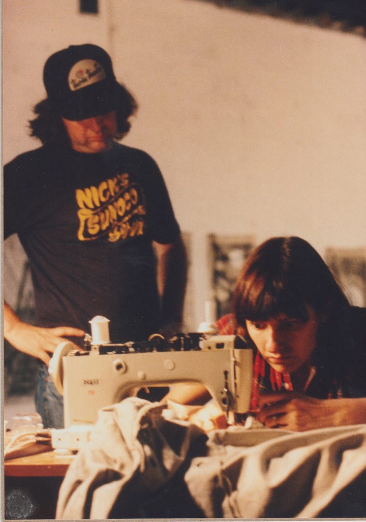 2 photos of Gabriele sewing and inspecting the tipi