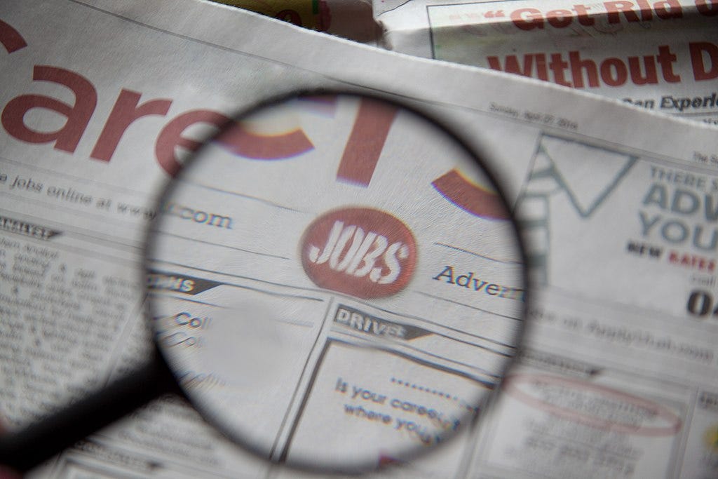 Magnifying glass and job ads