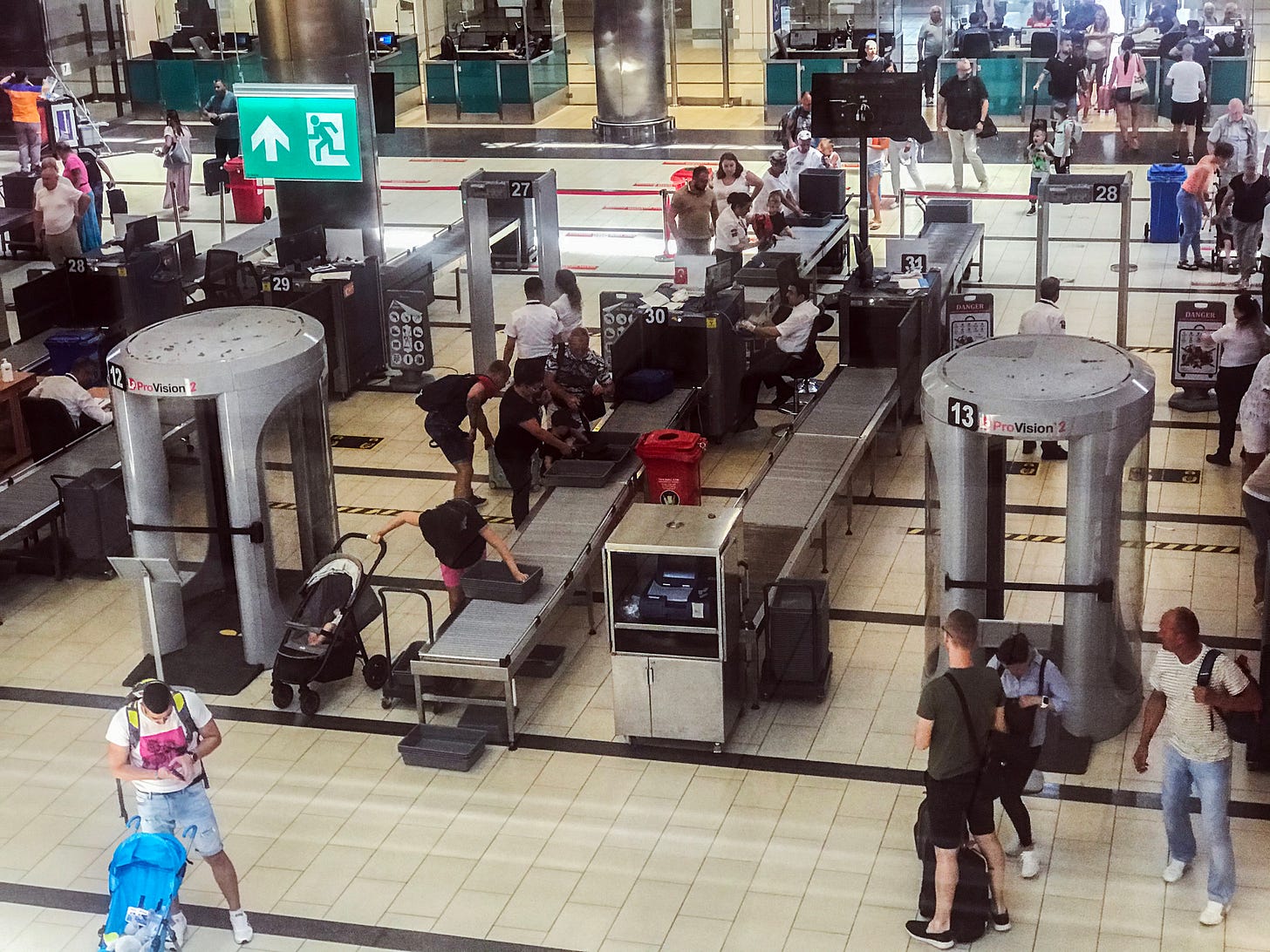A crowded airport security area A crowded airport security area