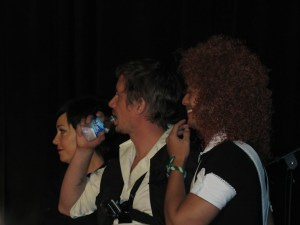 Kim, Chad and Osric sing karaoke backup