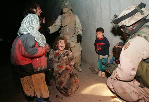 Iraqi children cry after their parents were killed when U.S. Soldiers with the 1st Battalion, 5th Infantry Stryker Brigade Combat Team of the 25th... Iraqi children cry after their parents were killed when U.S. Soldiers with the 1st Battalion, 5th Infantry Stryker Brigade Combat Team of the 25th...