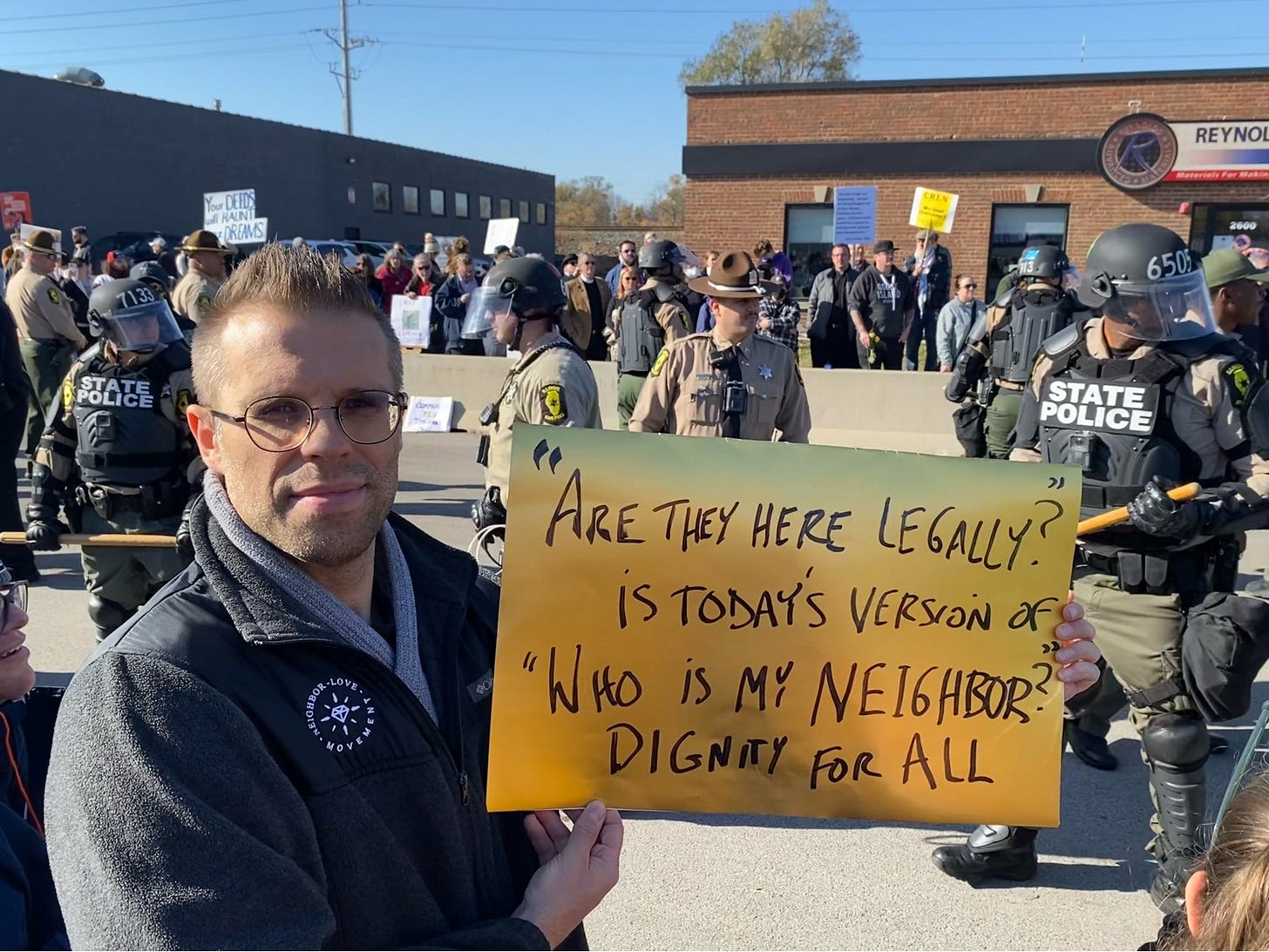 May be an image of ‎text that says '‎民团 SRAUNL R REYNO 고소지품 650 STATE POLICE ARE THEY HERE LEGALLY? is TODAYS VERSION לר "WHO is MY NEI6HB HBOR DIGN FOR ALL‎'‎