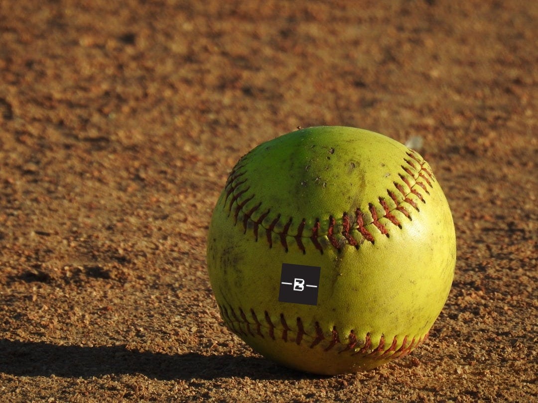 green baseball on floor