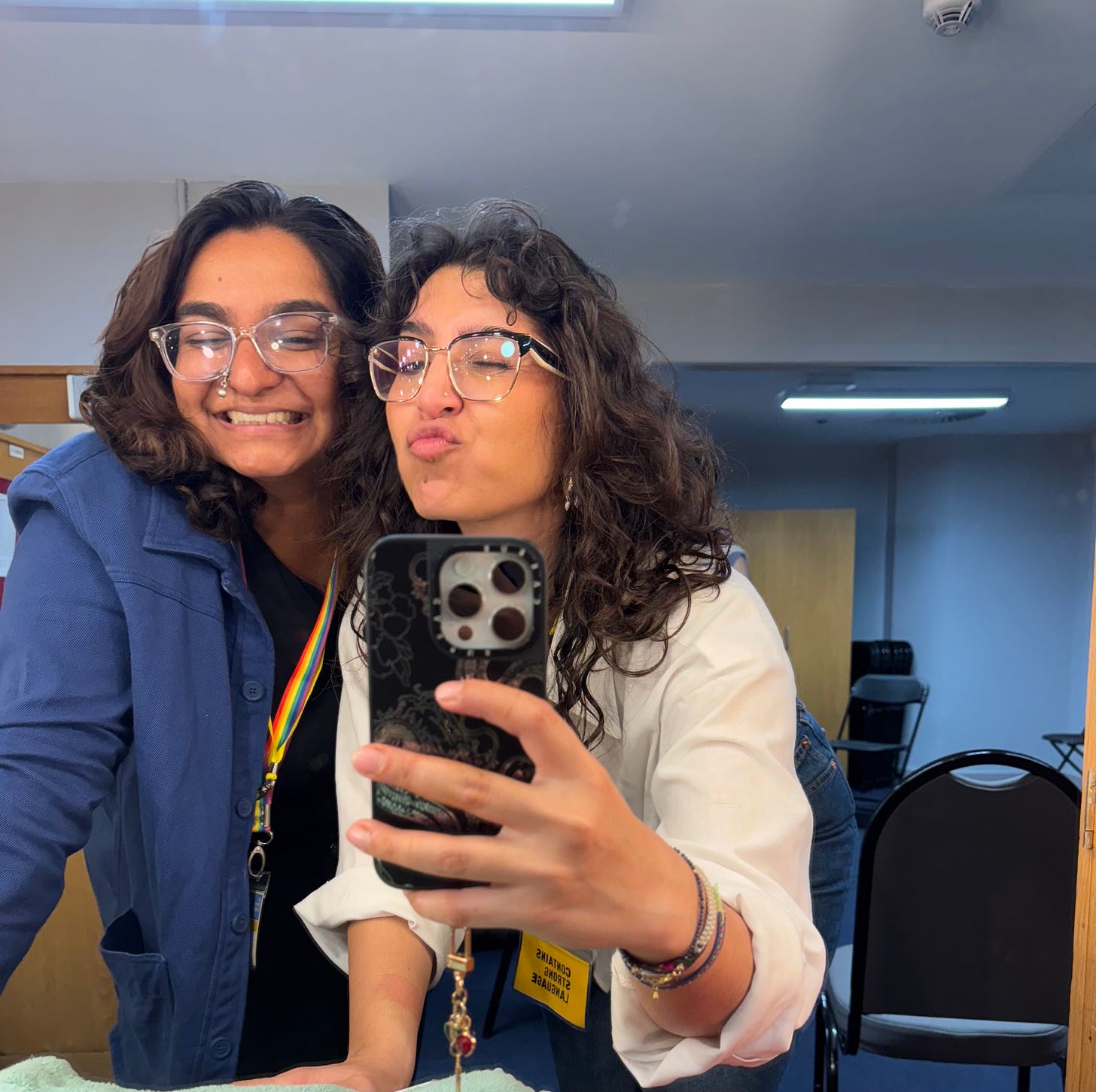 me and megha - two curly haired, four-eyed, bisexual, fluid babes