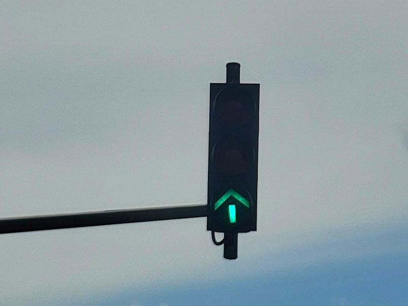 a traffic light with a green arrow on it a traffic light with a green arrow on it