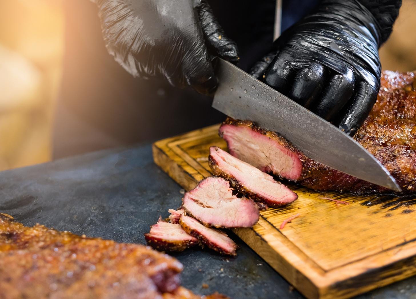Smoked brisket being sliced in Kansas City, a World Cup 2026 host city where destination coordination challenges will be most visible Smoked brisket being sliced in Kansas City, a World Cup 2026 host city where destination coordination challenges will be most visible