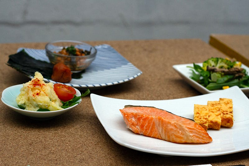 Natto, sour plum, potato salad, grilled salmon, Japanese omelette and a seasonal salad from Cibi in Collingwood, all part of their Japanese breakfast.