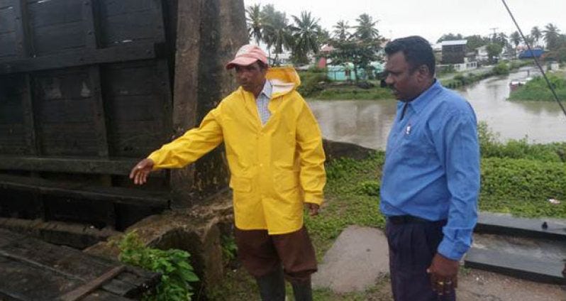 Region 2 Chairman, Parmanand Persaud inspecting a sluice