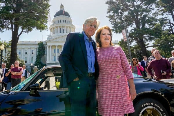 Jay Leno poses for a photo with State Sen. Shannon Grove in front of a Pontiac Trans Am. The State Capitol is seen behind them. Jay Leno poses for a photo with State Sen. Shannon Grove in front of a Pontiac Trans Am. The State Capitol is seen behind them.