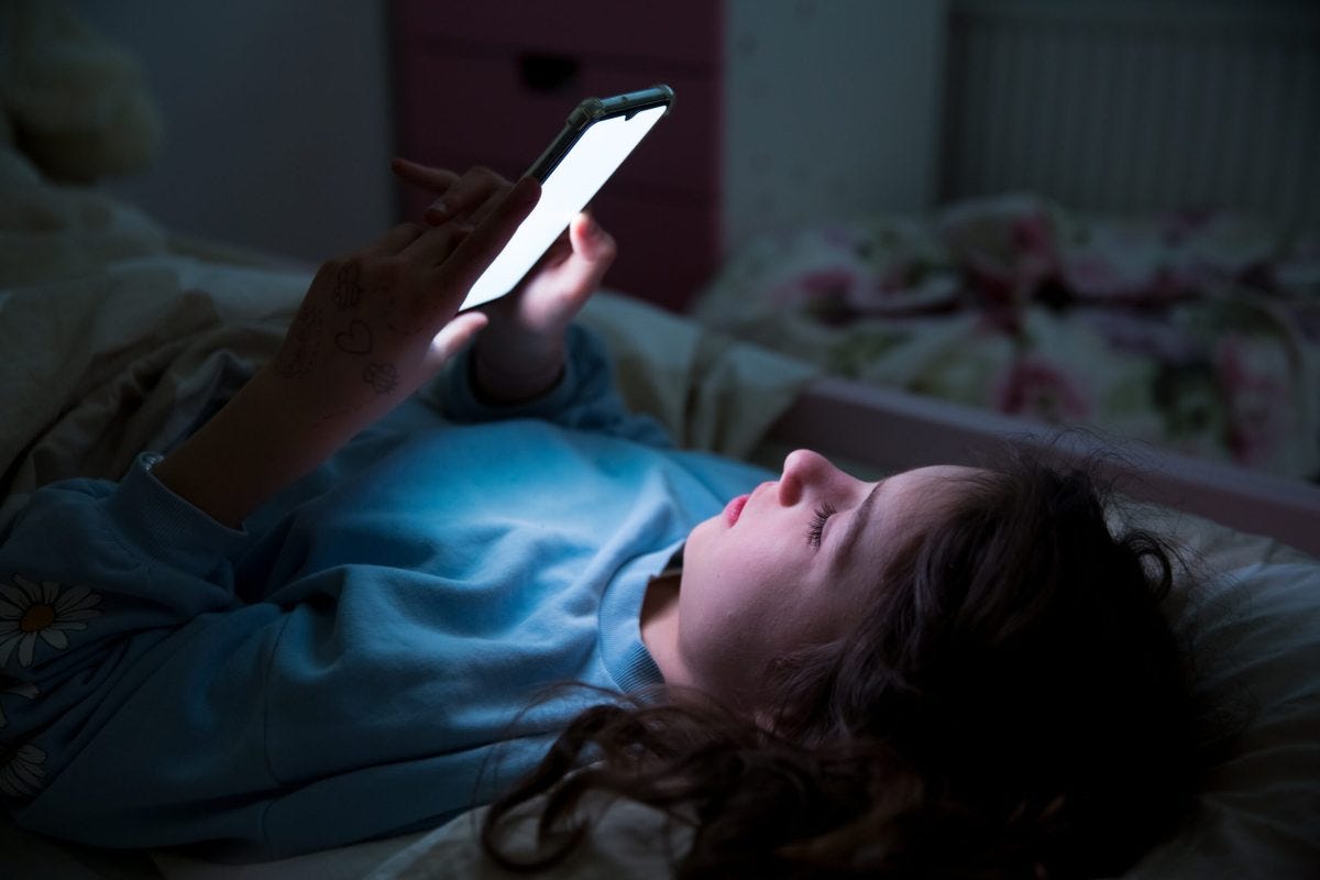 overtired girl on her phone at night. Social media addiction. Videogame addiction. Dopamine addiction. Burnout. Mental health issues. overtired girl on her phone at night. Social media addiction. Videogame addiction. Dopamine addiction. Burnout. Mental health issues.