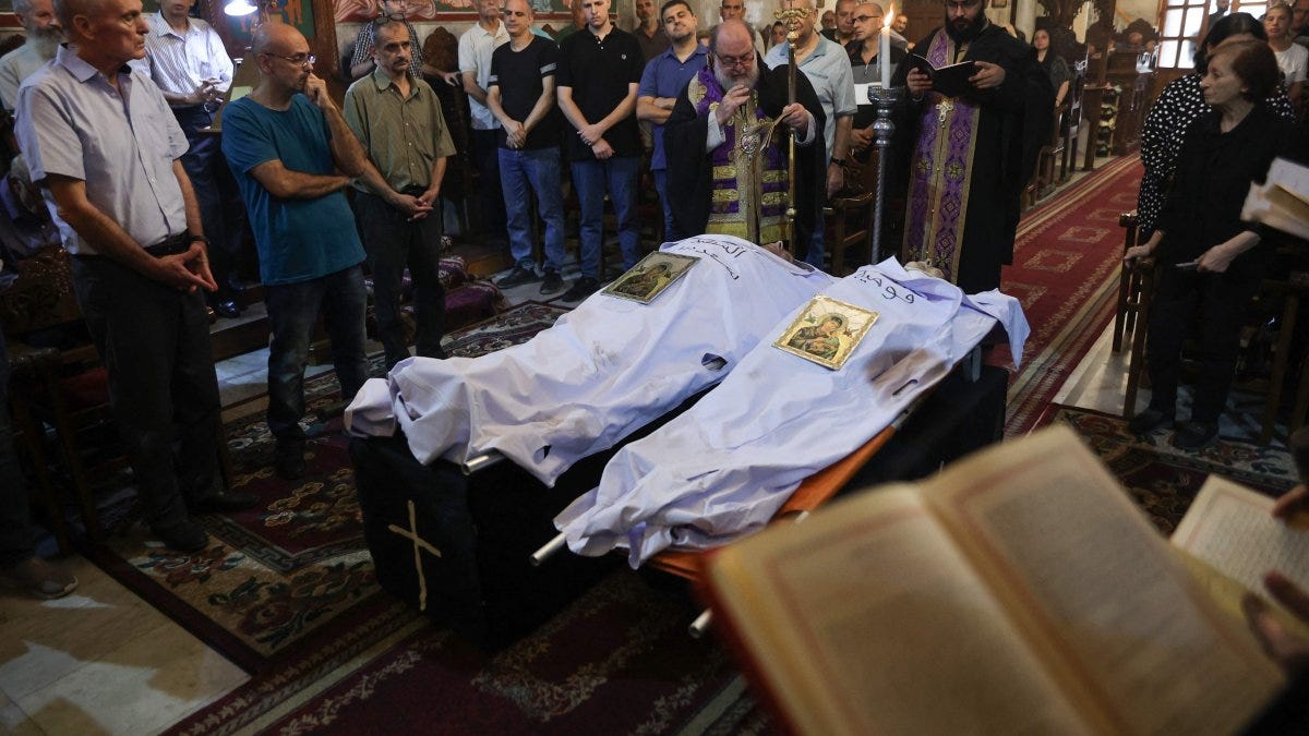 Archbishop Alexios blesses the bodies of Saad Salameh and Foumia Ayyad, killed earlier in an Israeli strike that hit the Holy Family church, Gaza City, Palestine, July 17, 2025. (AFP Photo) Archbishop Alexios blesses the bodies of Saad Salameh and Foumia Ayyad, killed earlier in an Israeli strike that hit the Holy Family church, Gaza City, Palestine, July 17, 2025. (AFP Photo)