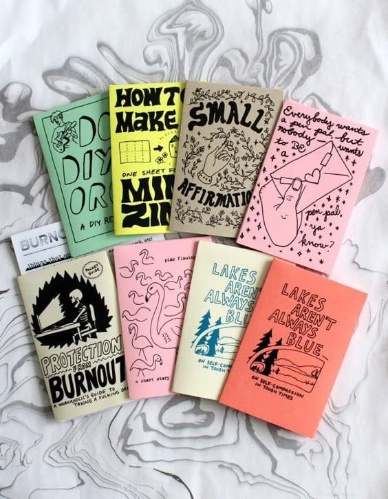 This may contain: six books are laying on top of each other