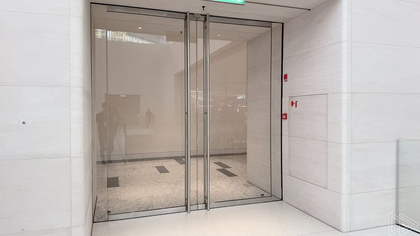 A set of double doors at a side entrance in Apple The Exchange TRX. A set of double doors at a side entrance in Apple The Exchange TRX.