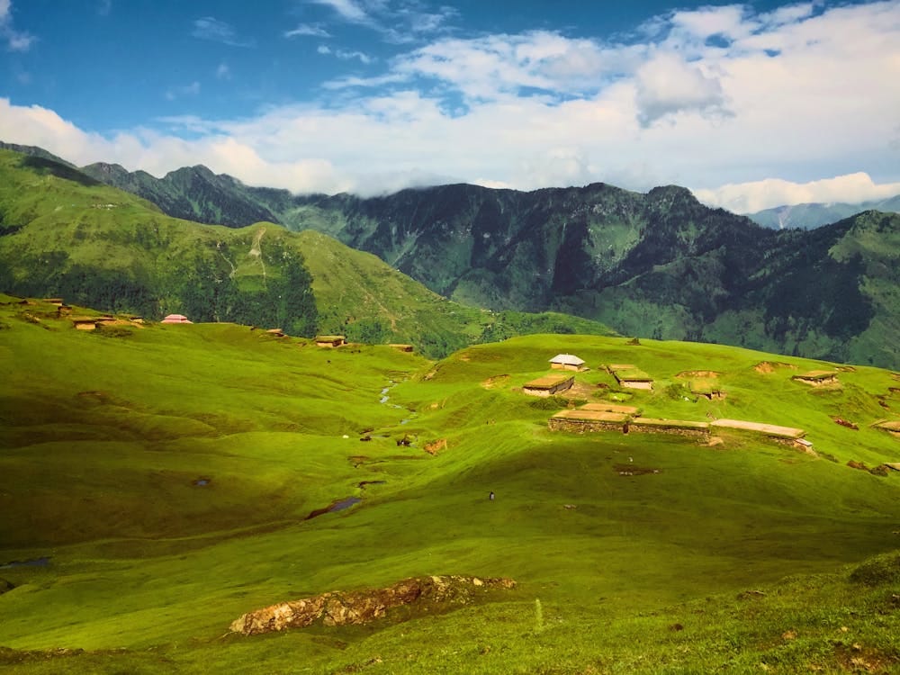 Free Breathtaking view of lush green hills and mountains in Haveli Azad Kashmir, perfect for a nature escape. Stock Photo