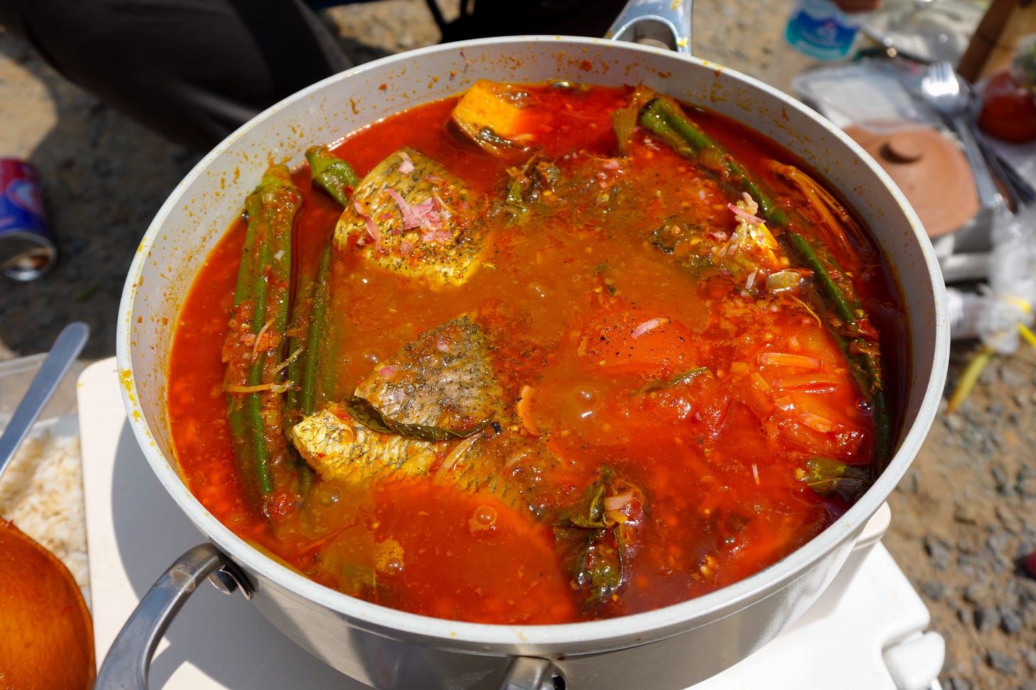 fish and okra in a red stew asam curry