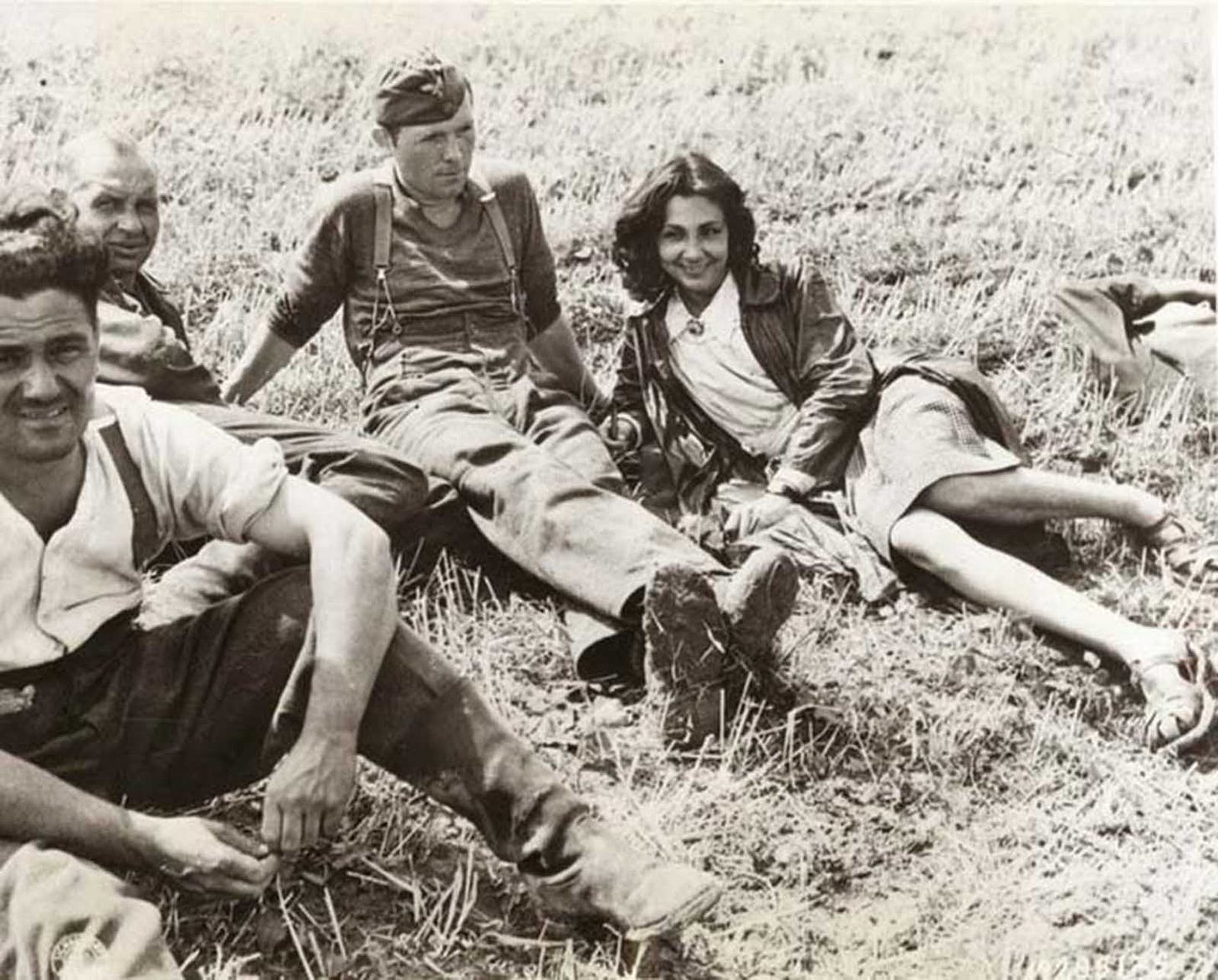 A poignant scene: A French woman accompanies her captured German fiancé into a prison compound in August 1944, a desperate act for protection amidst post-liberation retribution. A poignant scene: A French woman accompanies her captured German fiancé into a prison compound in August 1944, a desperate act for protection amidst post-liberation retribution.