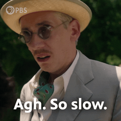 A man in an ascot and summer hat says agh so slow