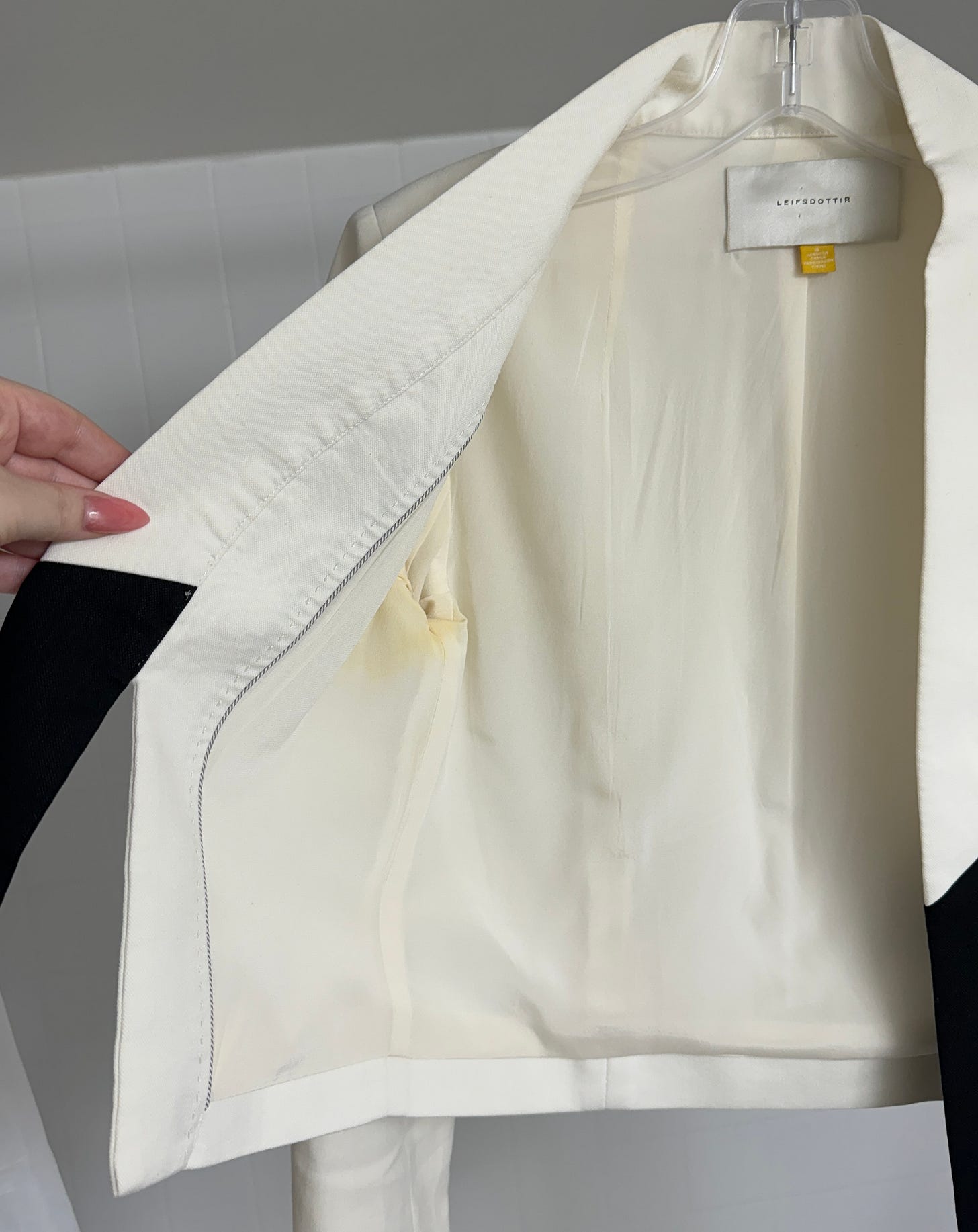 discolored armpit/armhole area of a white jacket