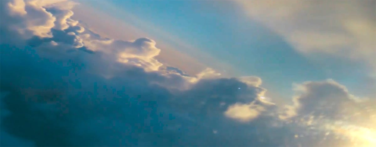 Sunshine on high cloud shot from altitude - still from 1978 film Grease