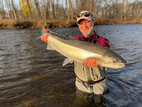 angler with large permit standing in the water