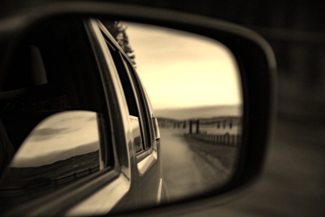 wing mirror reflecting road on desert wing mirror reflecting road on desert
