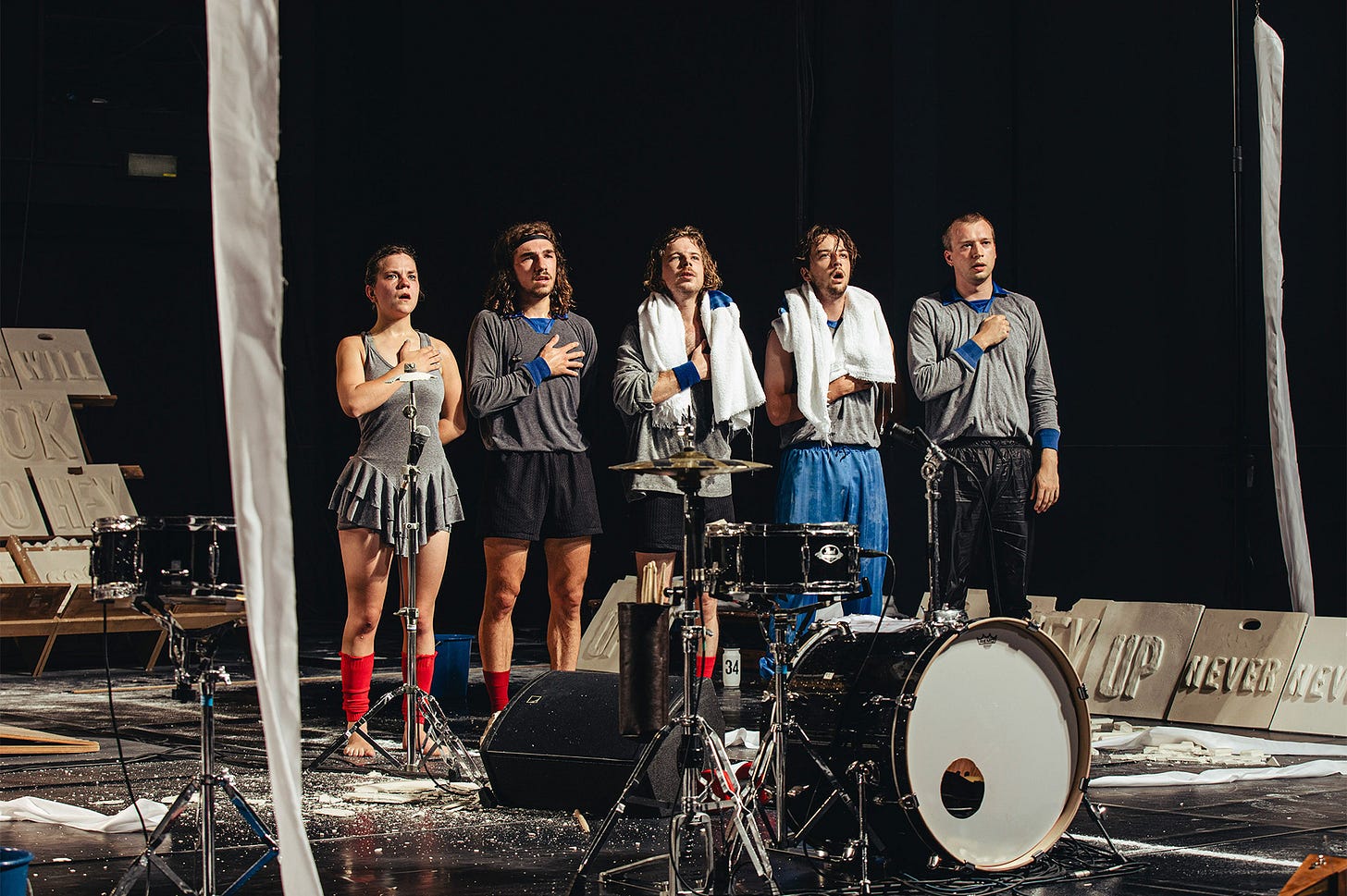 The cast of One Song sing a national anthem
