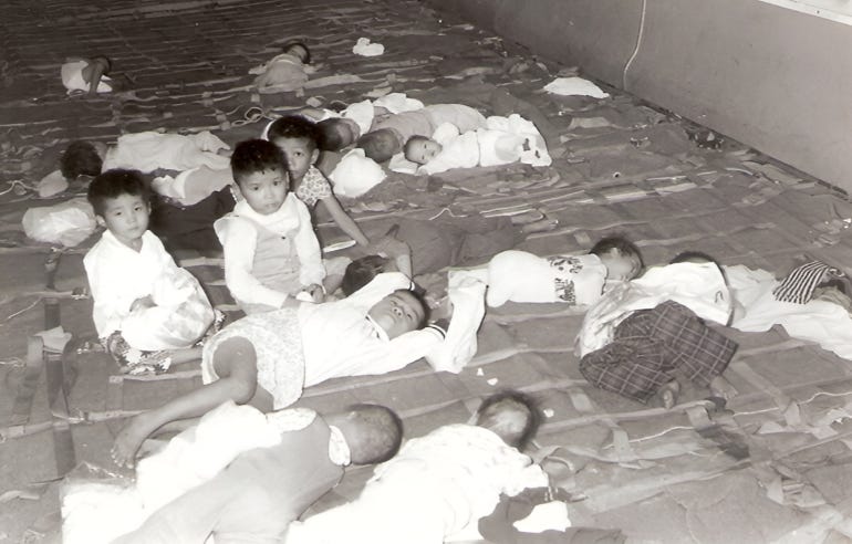 Adoptees on board one of the flights [Courtesy of Frederick Burkle]
