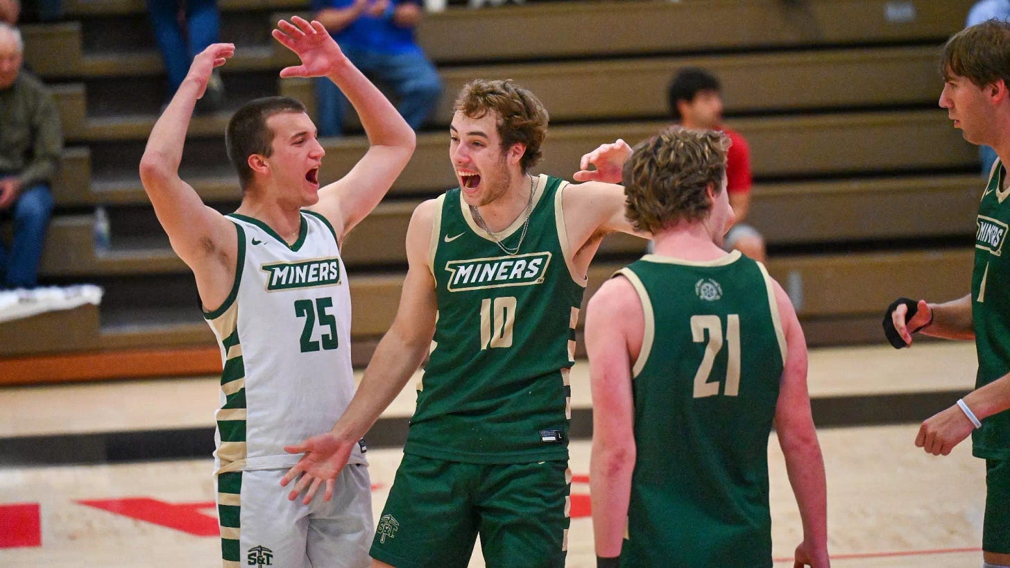 Nate Meyer and Bartosz Chmielewski celebrate after a lock by Meyer during a mens volleyball match 