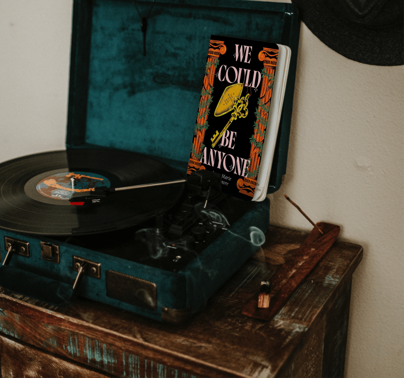 Book "We Could Be Anyone" on a record player Book "We Could Be Anyone" on a record player