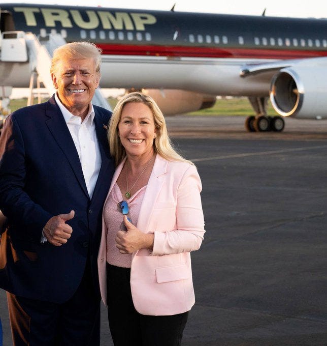 May be an image of 2 people, people standing and text that says 'm TRUMP'