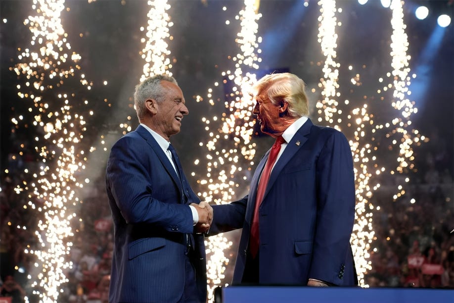 Robert F. Kennedy Jr. and Donald J. Trump shaking hands on stage in Arizona with fireworks in the background, marking RFK Jr.'s endorsement of Trump. Robert F. Kennedy Jr. and Donald J. Trump shaking hands on stage in Arizona with fireworks in the background, marking RFK Jr.'s endorsement of Trump.