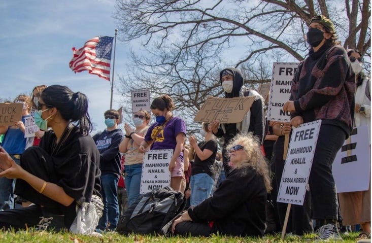 A group of people protesting

AI-generated content may be incorrect.
