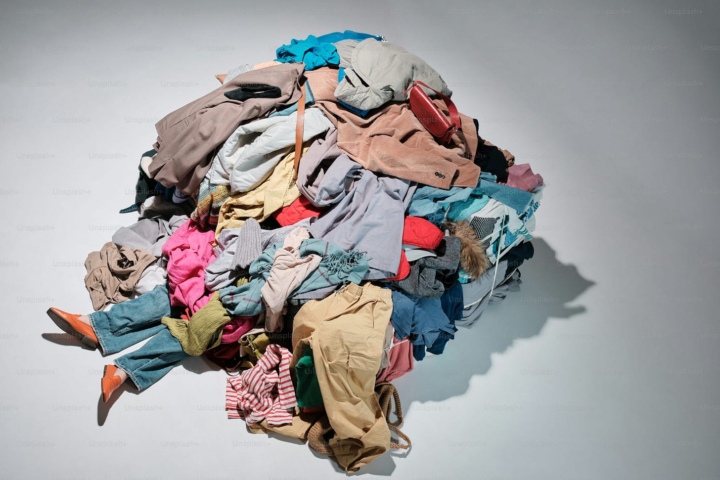 a pile of clothes sitting on top of a white table