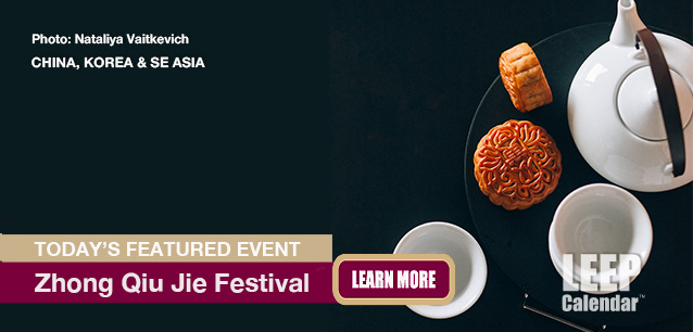 Mooncakes and tea on a black background