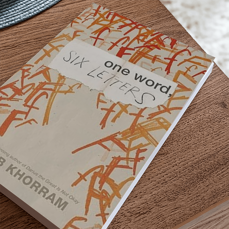 Book "One Word, Six Letters" on a table