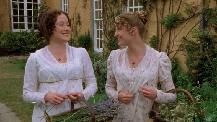 This may contain: two women in white dresses standing next to each other with baskets full of flowers on the ground