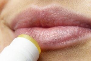 Lips getting chapstick applied to them