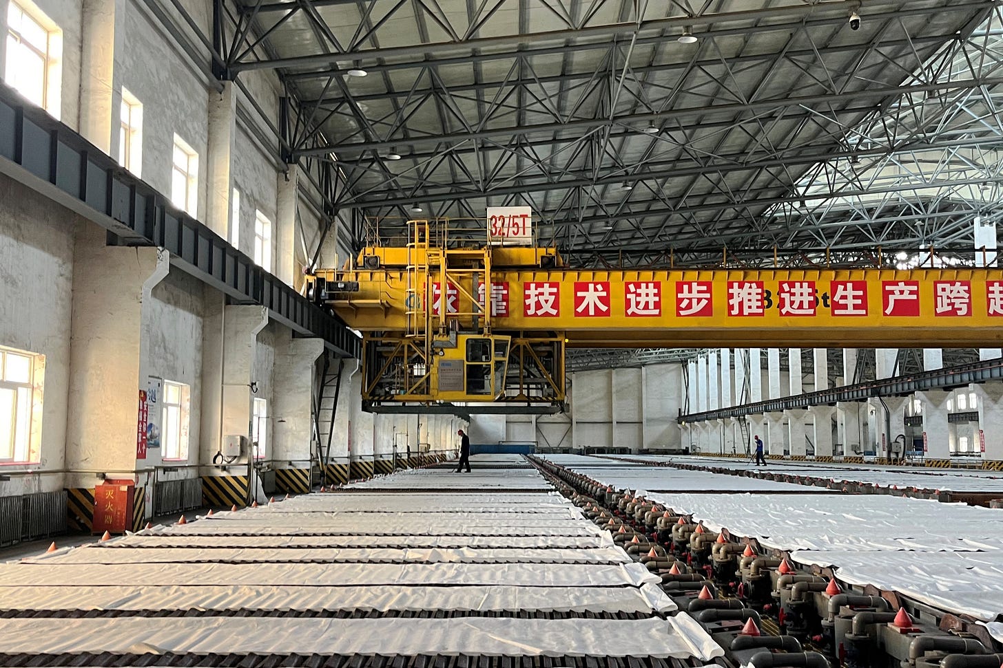 Employees work at a copper smelter in Yantai Employees work at a copper smelter in Yantai