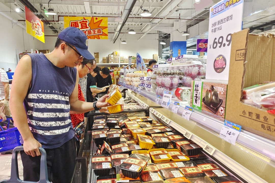 Customers shop at a supermarket in Shanghai on July 15. Photo: VCG